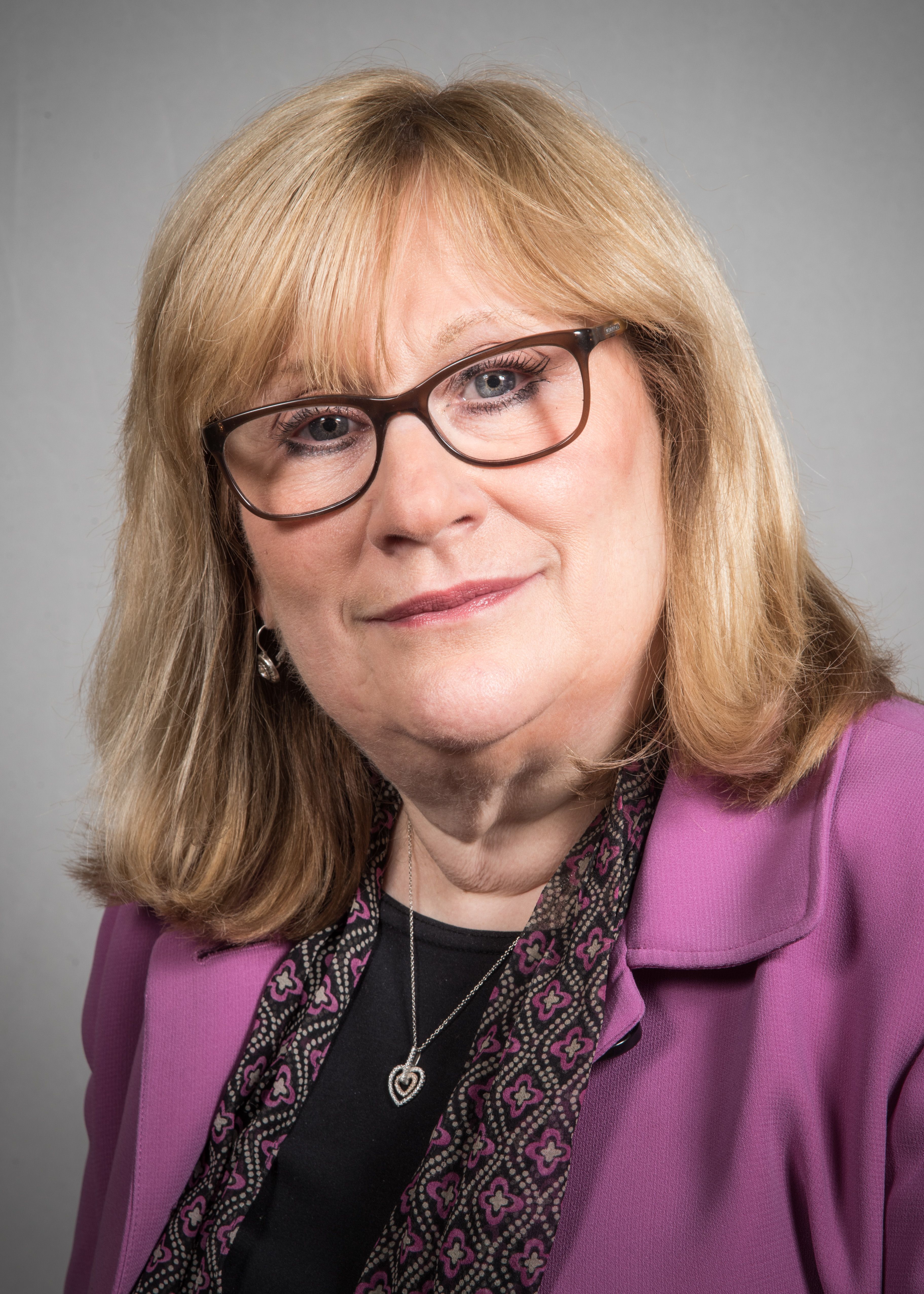 Ellen Pokorny, RN, wearing a purple jacket